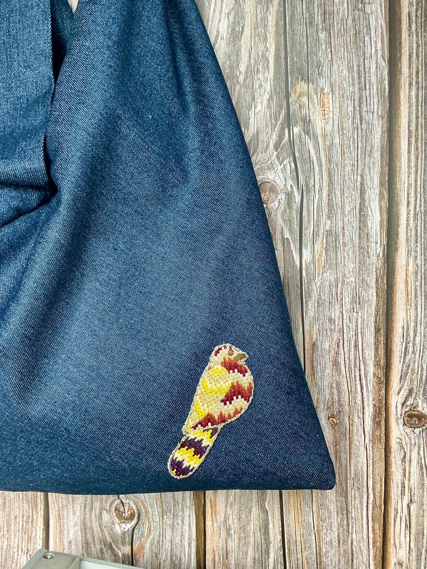 Origami denim bag with bird embroidery